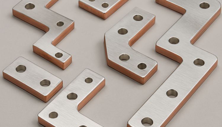 Six custom aluminum busbars with copper-plated edges displayed on a light gray background. Each busbar varies in size and shape, featuring smooth surfaces and evenly spaced mounting holes.
